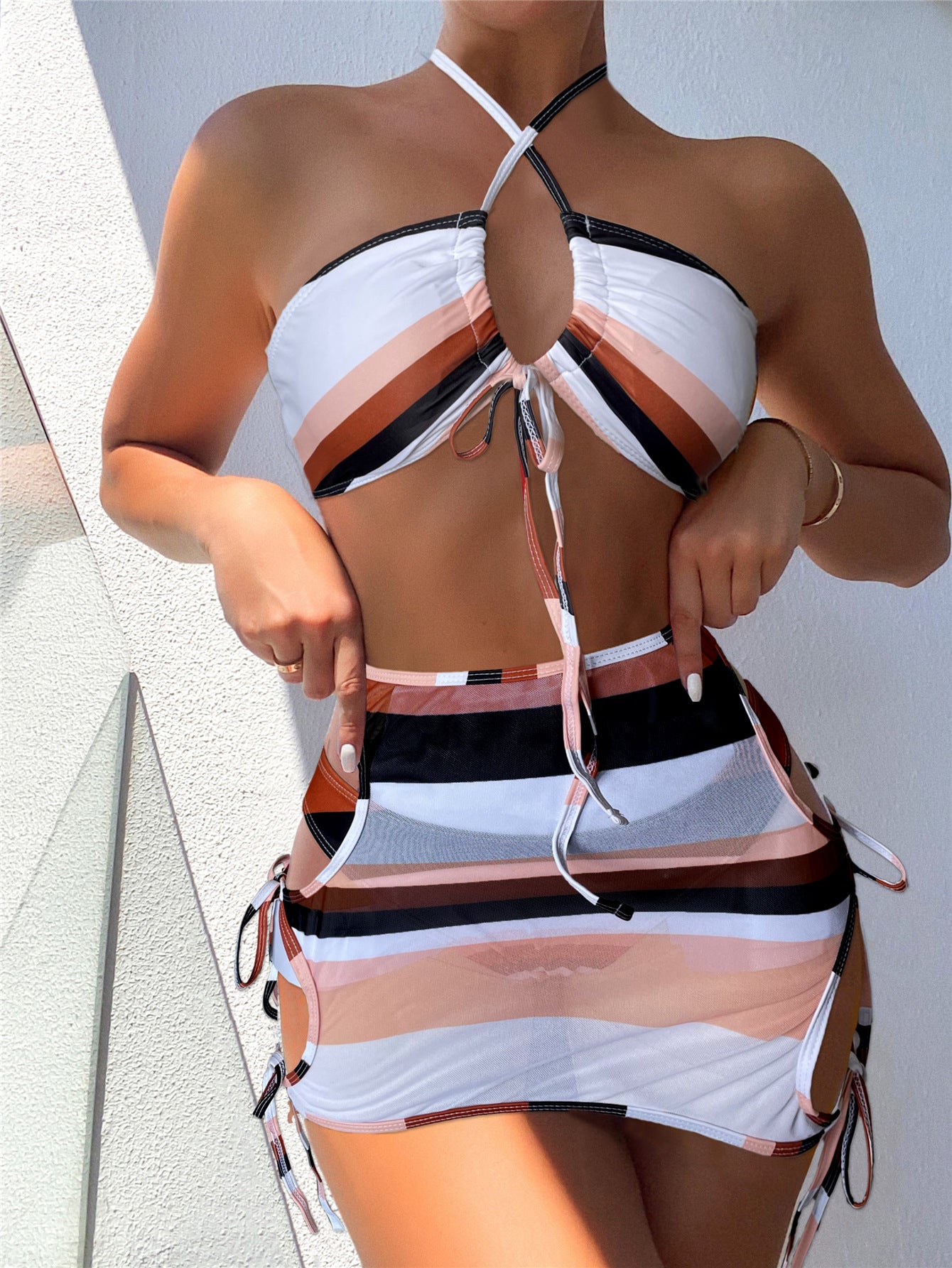 Women's clothing. Striped String Swimsuit